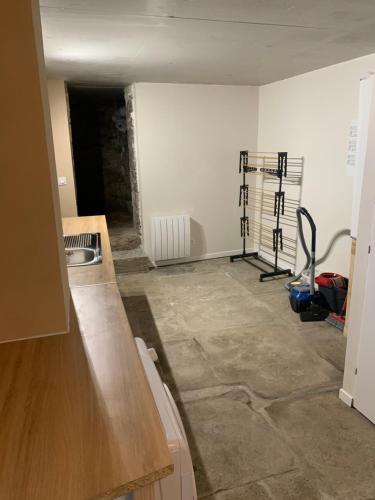 a kitchen being remodeled with the walls painted white at Gîte familial A la bonne heure in Chilhac