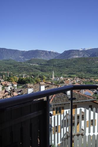 a view from the balcony of a building with mountains in the background at DAS BADL - Smart Retreat AO in Caldaro