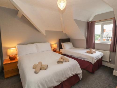 a room with two beds with towels on them at Fern Lee in Carlisle