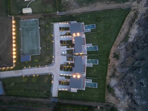 an overhead view of a building with street lights at Real Life Homes luxurious seafront villas each with their own private pools in Korakokhórion
