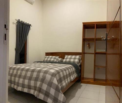 Ένα ή περισσότερα κρεβάτια σε δωμάτιο στο LOPE HOMESTAY