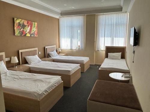 מיטה או מיטות בחדר ב-Agjabedi Olympic Center