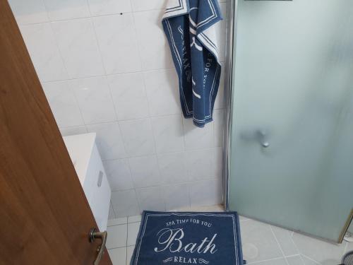 a sign in a bathroom with a bat hanging on a wall at near the sea even 14 days won't feel enough in Bat Yam