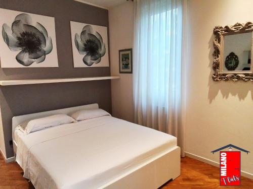 Un pat sau paturi într-o cameră la MilanoFlats - TriloGolinelli