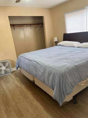 a bedroom with a large bed and a window at Outback Campground and Marina in Trinity