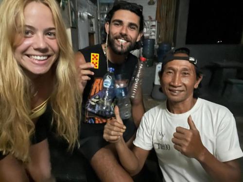 a group of three people giving the thumbs up at Apollo Hostel in Lovina