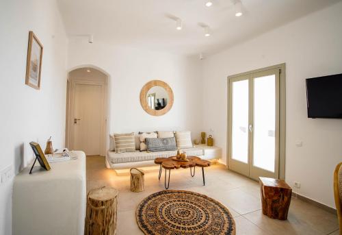 a living room with a couch and a table at Acria Villas in Pyrgos