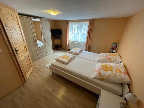 a bedroom with a large bed in a room at Weingut und Destillerie Bernd Klein in Pleisweiler-Oberhofen