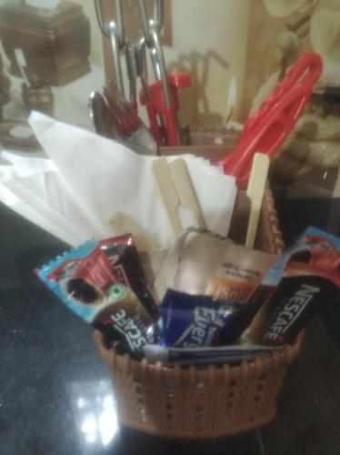a basket of food is sitting on a counter at Bhawani Kutir Villa Nainital in Nainital