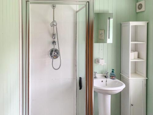 a bathroom with a shower and a sink at The House On The Point - Uk43807 in Kylerhea