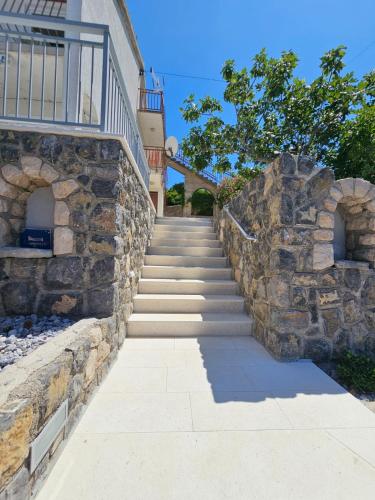 a stone stairway leading up to a house at Apartments Klara in Sveti Juraj