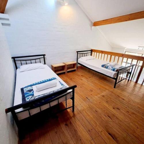 מיטה או מיטות בחדר ב-Loft Villa Pool Spa & Beach!