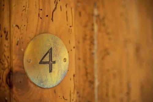 a wooden door with a number four on it at Les Jardins de Baracane in Avignon