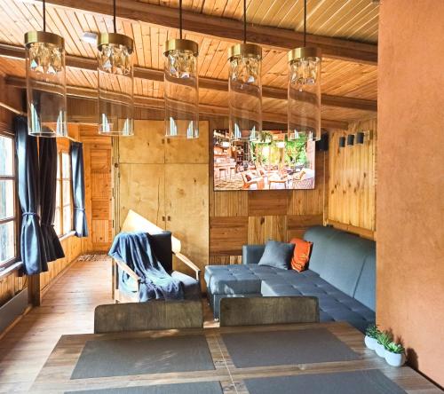 a living room with couches and a couch at Guest House 'Selgas', Engure in Engure