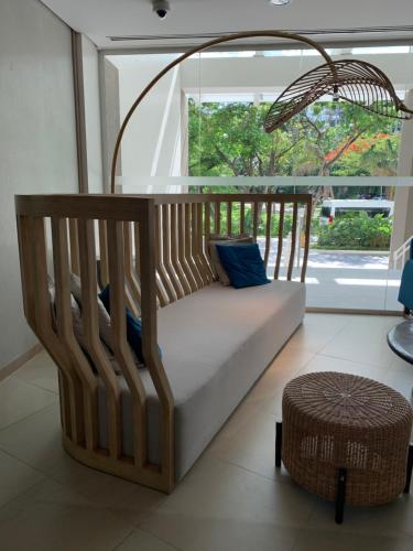 a bed in a room with a large window at 2BR spacious stylish condo near mall in Cebu City