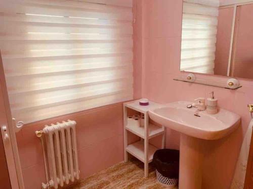 a bathroom with a sink and a mirror at CASA RURAL VILLARRUBIA in Villarrubia de los Ojos