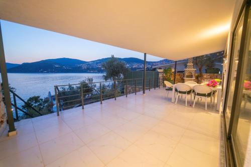 a balcony of a house with a view of the water at Villa Blue Coast I & II wBeach and Great Sea View - KALKAN in Kas