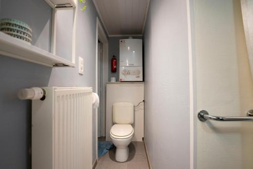 a bathroom with a toilet in a small room at Studio L'Épicurien in Spa