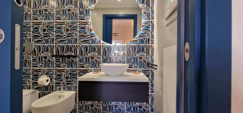 a bathroom with a sink and a toilet in it at SUITE LUCIA in Capri