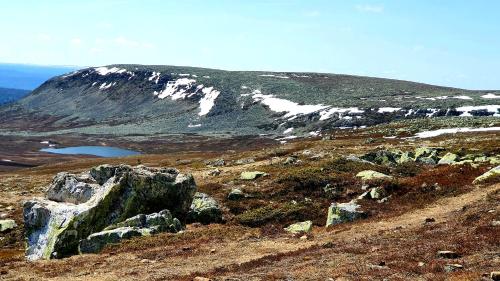 a view of a mountain with snow on it at Stationshuset Dalarna Apartments in Sörsjön