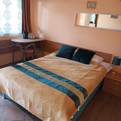 Postel nebo postele na pokoji v ubytování Vanilla Pokoje i Apartamenty Nad Brzegiem Jeziora