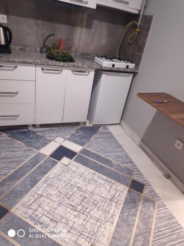 a kitchen with a tile floor in a kitchen at Palmas Apart in Istanbul