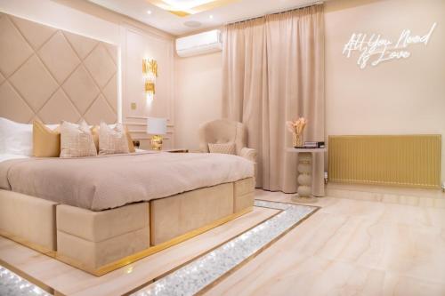 a bedroom with a king sized bed in a room at Alexandras Palace in Bradford