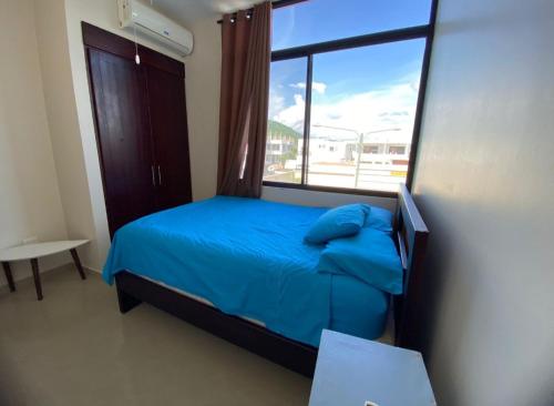 Giường trong phòng chung tại Departamento amoblado con piscina en San Clemente