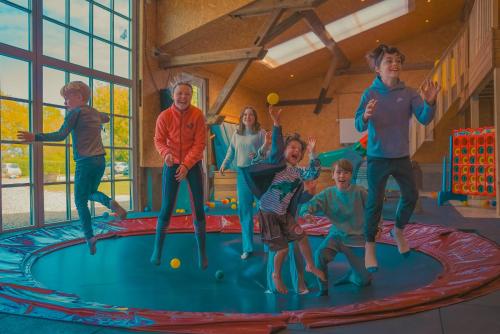 a group of children jumping on a trampoline at Brise in Westermarkelsdorf