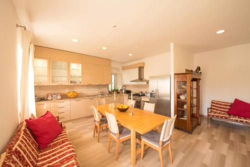 a kitchen and dining room with a table and chairs at Azienda Agricola Villa Castelluccia in Foce Varano
