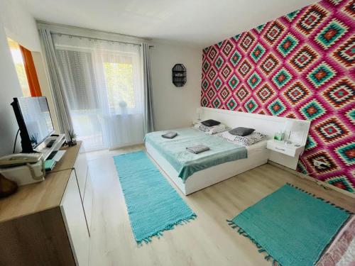 Posteľ alebo postele v izbe v ubytovaní Joy Apartman