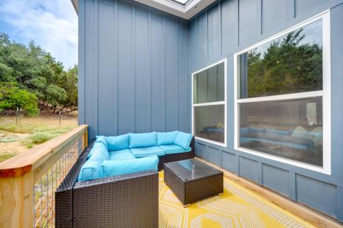 a porch with a couch and a table and a window at Canyon Lake Oasis Backyard and Wraparound Deck! in Canyon Lake