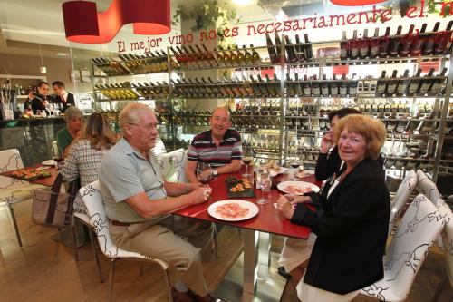 a group of people sitting at a table in a restaurant at Hotel Norat Marina & Spa 4* Superior in O Grove