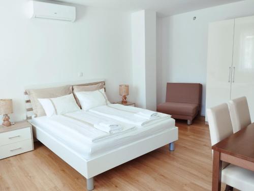 Postel nebo postele na pokoji v ubytování Apartments Wallas