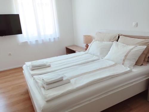 Postel nebo postele na pokoji v ubytování Apartments Wallas