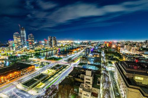 a city lit up at night with traffic at Trendy Apartment in Puerto Madero in Buenos Aires