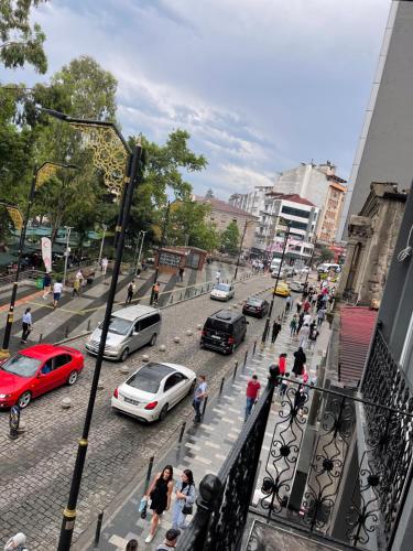 a busy city street with cars parked on the street at BORDO SUİTE HOTEL in Trabzon