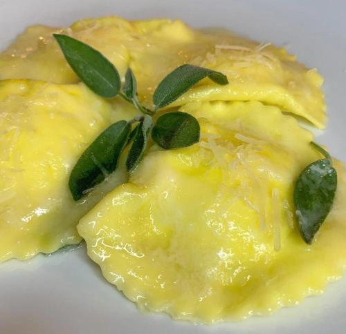 a piece of food with a green leaf on top at Terrae Eremis: Ristorante, Bar, B&B in Roccamorice