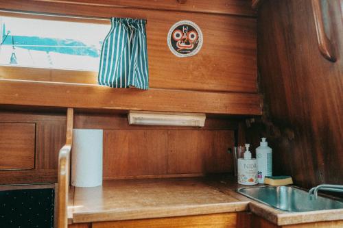 a kitchen with a sink and a counter top at Jachta " Džaladūta" in Nida