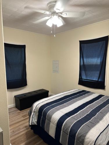 a bedroom with a bed and a ceiling fan at NEW Private House A with Carports EV Plugin L2 in Twin Falls