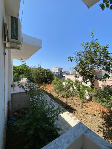 a view from the balcony of a house with a walkway at Ksamil Guest House Dea in Ksamil