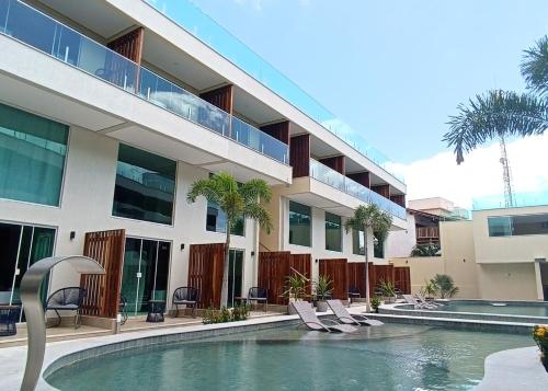 a swimming pool in front of a building at Star Palace Hotel Jeri in Jericoacoara