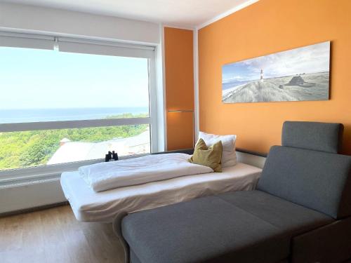 Ένα ή περισσότερα κρεβάτια σε δωμάτιο στο Frische-Brise-FeWo12-09