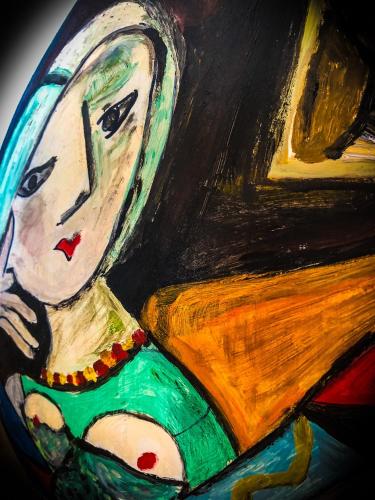 a painting of a woman sitting in a chair at STRAPALU' in Fondi