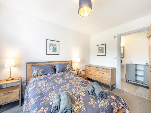 a bedroom with a bed and two night stands at Number 29 in Alnwick