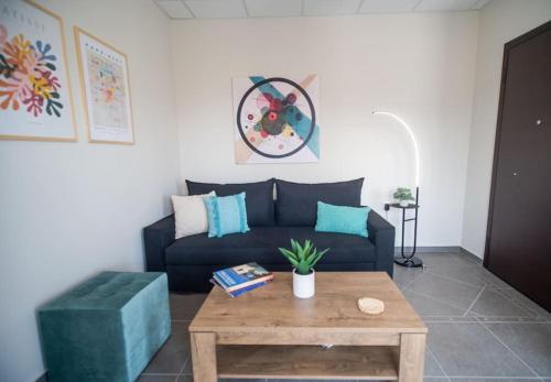 a living room with a couch and a coffee table at Luxury Apartment in Chalkida #1 in Chalkida