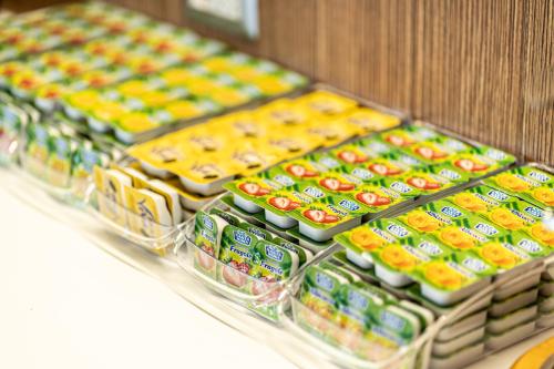 a display of food on a shelf in a store at Hotel Smeraldo in Qualiano