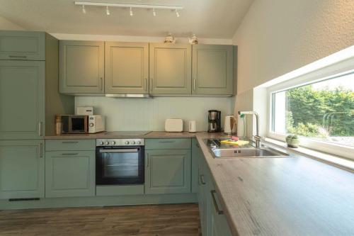 Dapur atau dapur kecil di Ferienhaus-Belvedere-2-c