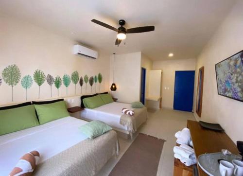 Ein Bett oder Betten in einem Zimmer der Unterkunft sunsteps casa Holbox