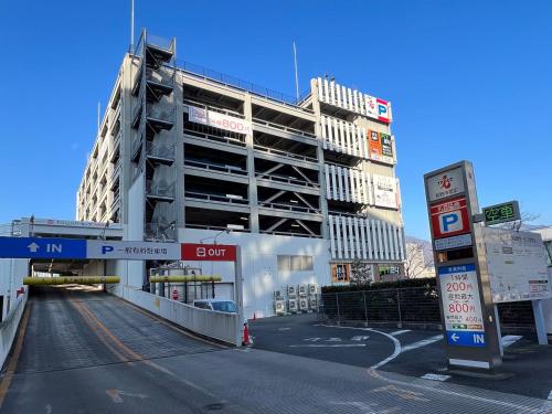 a building that is under construction next to a gas station at Hotel JAL City Nagano in Nagano